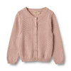 Pink knitted cardigan with button details on a light gray background