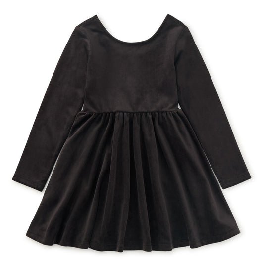 Black velour dress with long sleeves on a white background