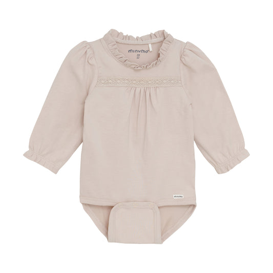 Beige baby bodysuit with ruffled collar on a white background