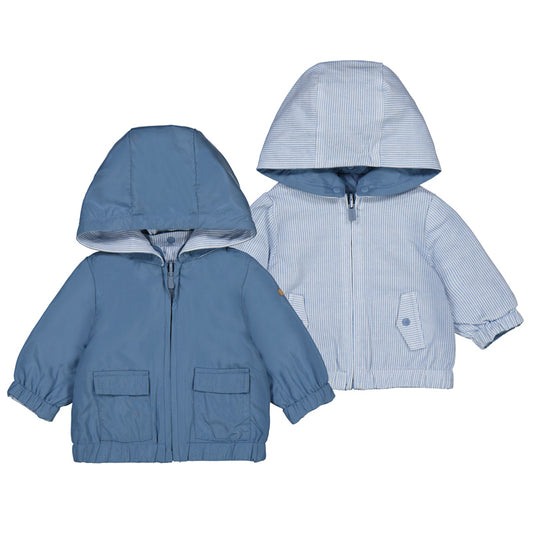 Reversible blue hooded jackets on a white background