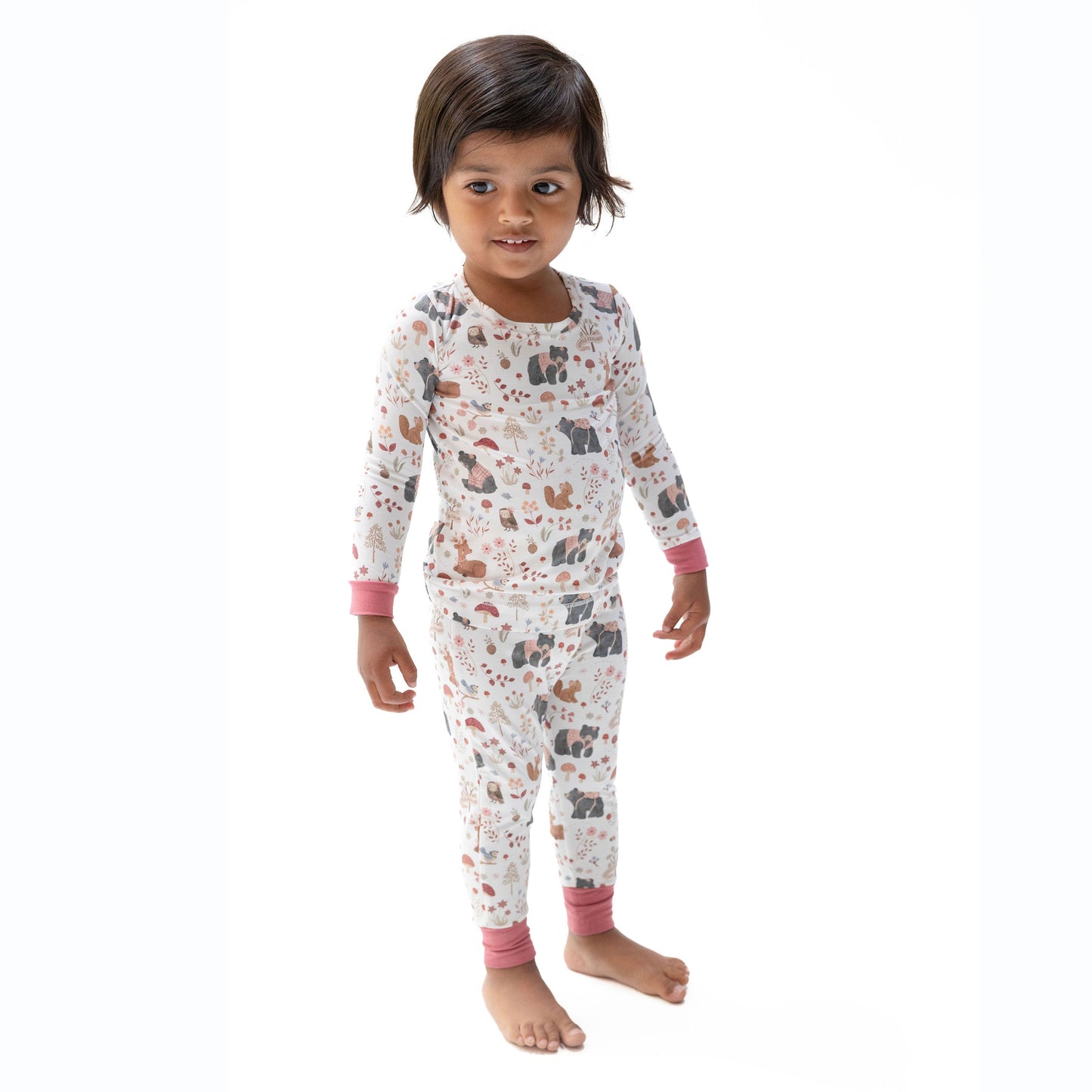 Toddler girl wearing Angel Dear Pink Woodlands loungewear set, lifestyle photo