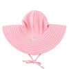 Pink sun hat with a tie on a white background