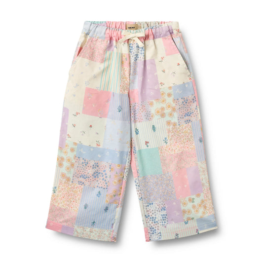 Pastel patchwork pants on a white background