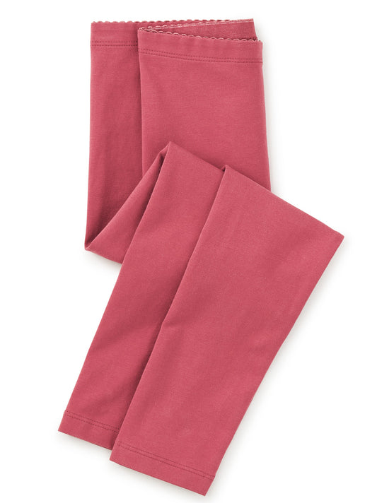 Two pink leggings on a white background