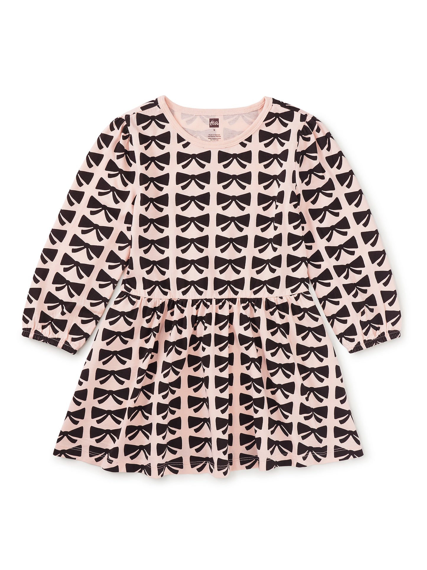 Pink dress with black bow pattern on a white background