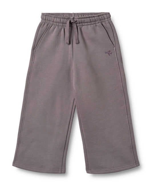 Purple sweatpants with a small logo on a white background