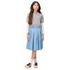 Young girl wearing a gray striped polo shirt, light blue skirt, and white sneakers on a white background