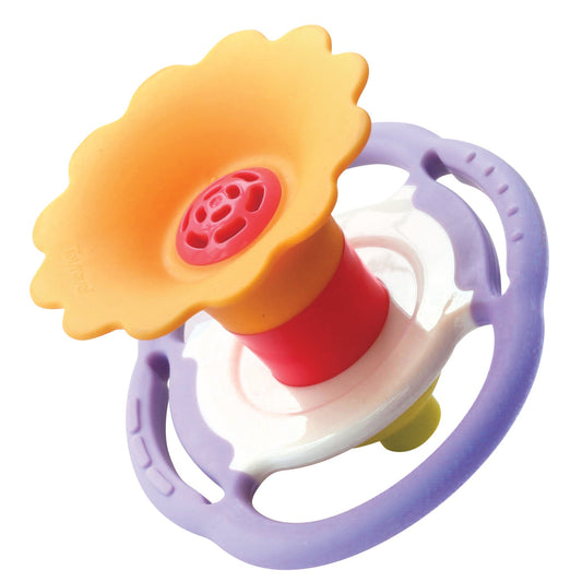 flower shaped baby whistle on white background