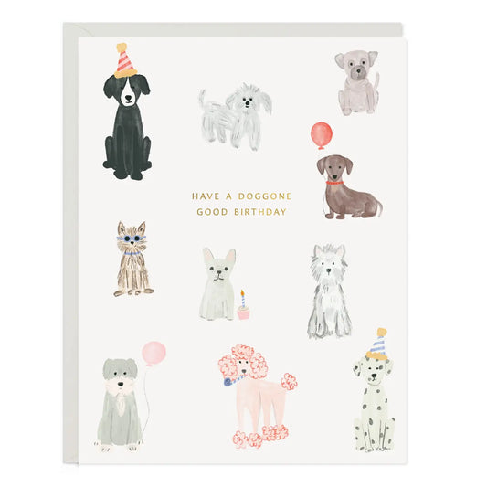 Birthday card with illustrated party pups, gold foil lettering