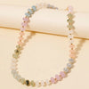 Beaded bracelet with pastel-colored beads on a beige background