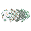 Four baby bandana bibs with woodland, plaid, and forest prints