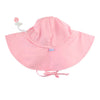 pink sun hat with ties on a white background