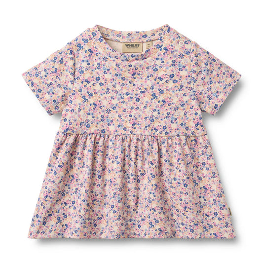 Floral dress with a visible brand label on a white background