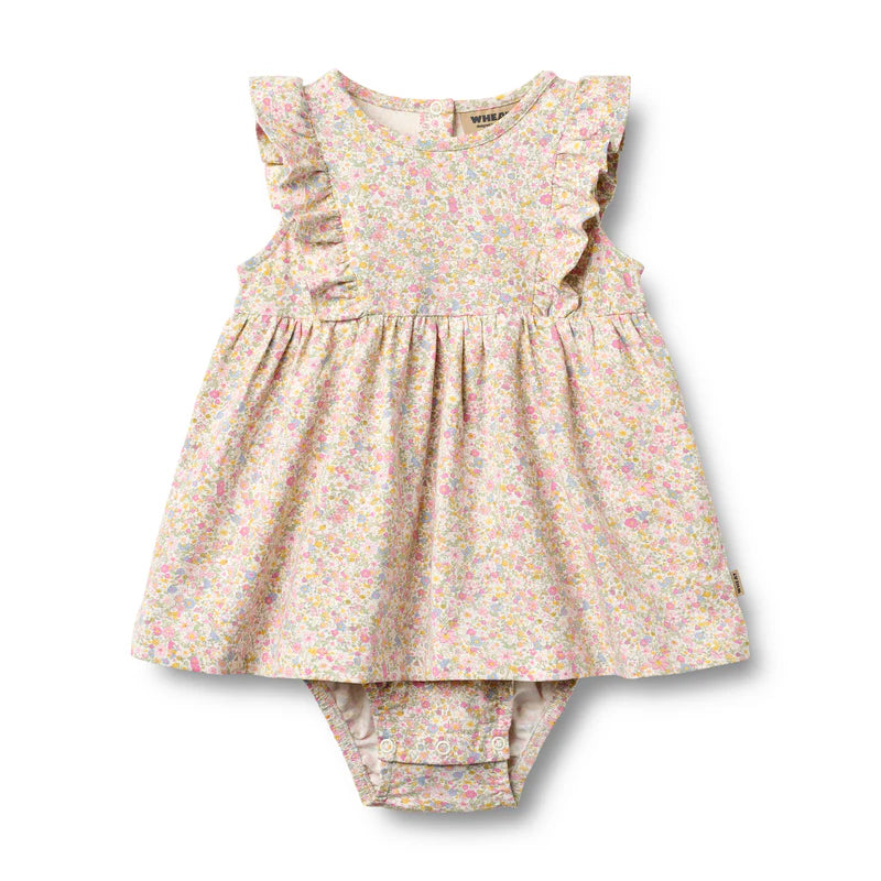 Floral baby dress and bloomers set on a white background