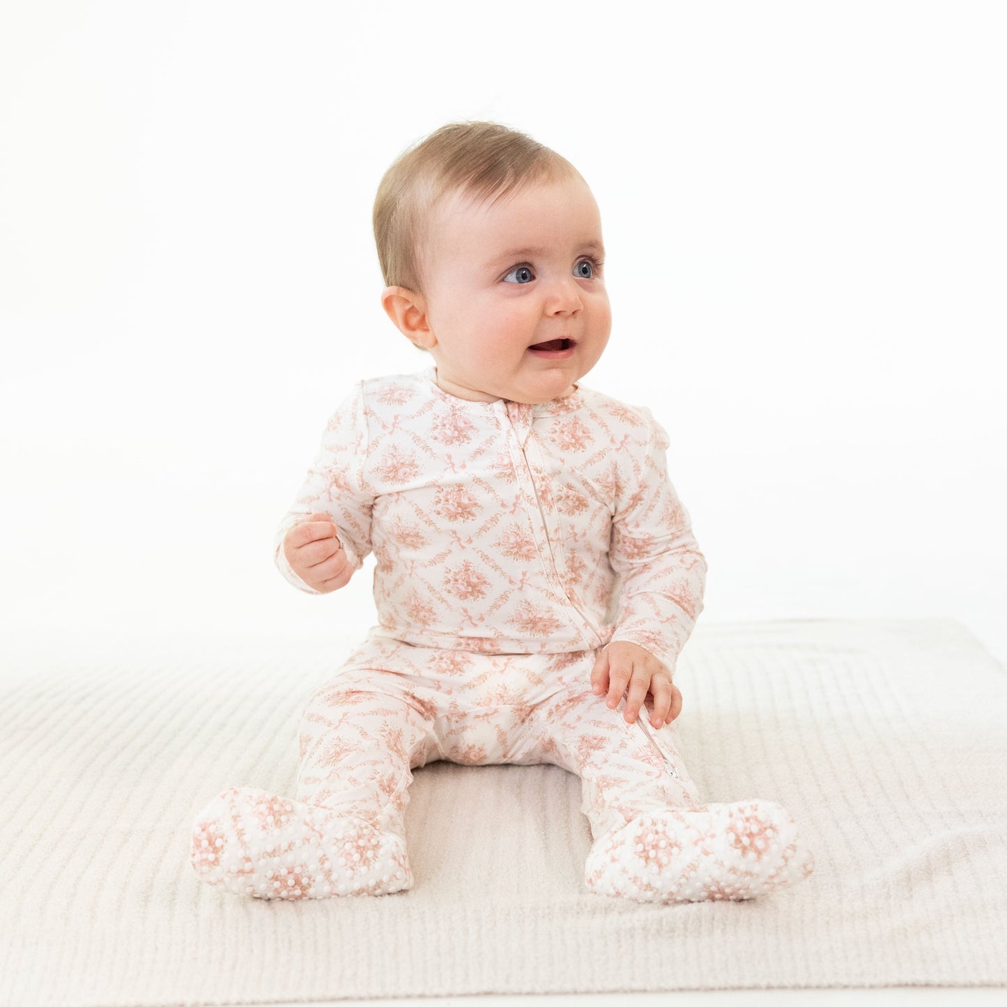 Rose Lattice Ruffle Zip Footie by Angel Dear, lifestyle view