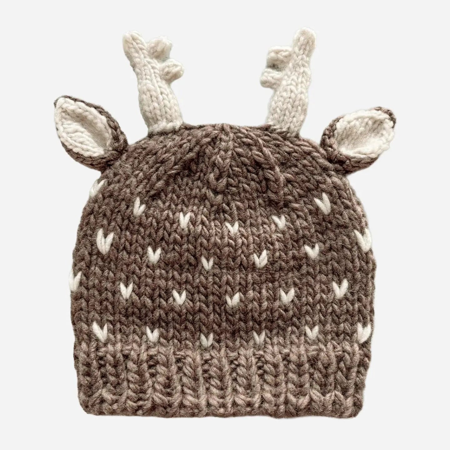 A brown and cream knit baby hat designed like a deer, featuring a textured brown body with cream-colored antlers and ears, shown against a plain light gray background.