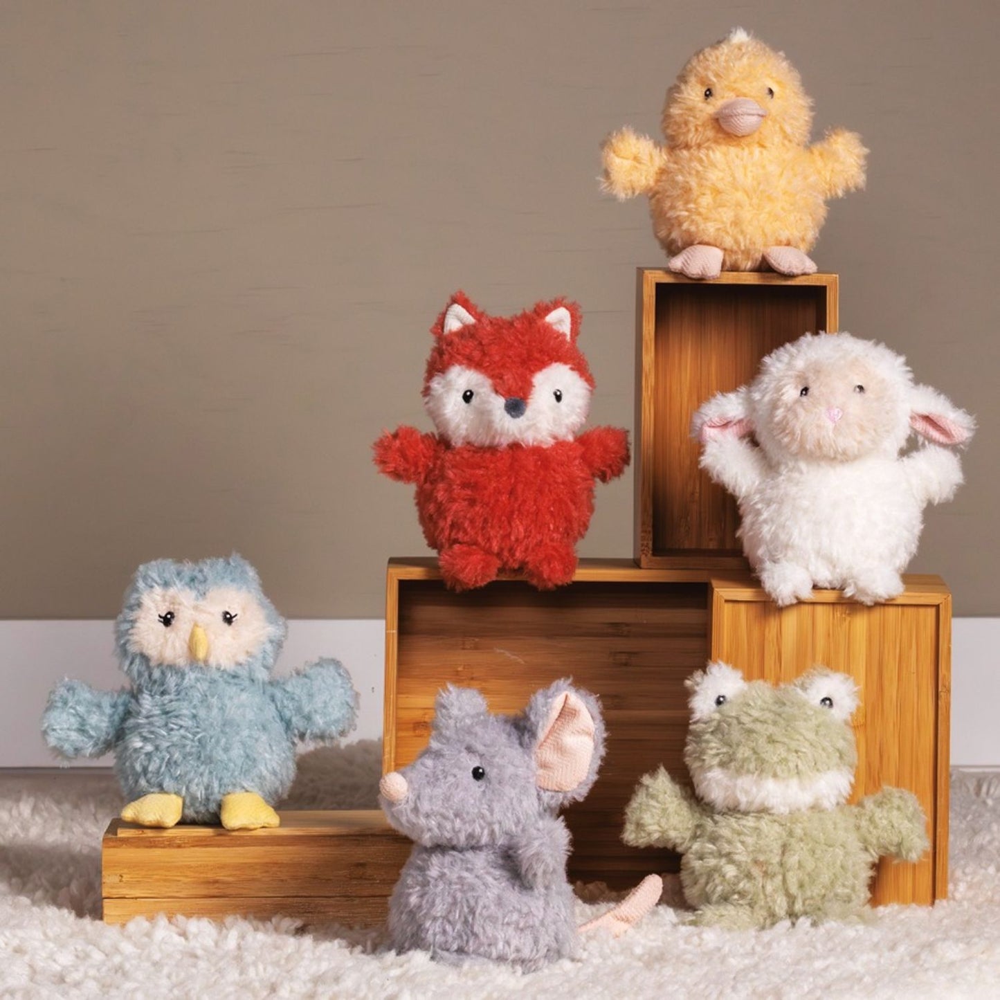 Soft recycled character rattles for mindful baby play