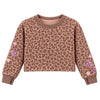 A cropped long-sleeve sweatshirt with a brown and beige leopard print pattern, ribbed crew neck, cuffs, and hem, featuring pink embroidered flowers and hearts on the sleeves, shown against a plain white background.