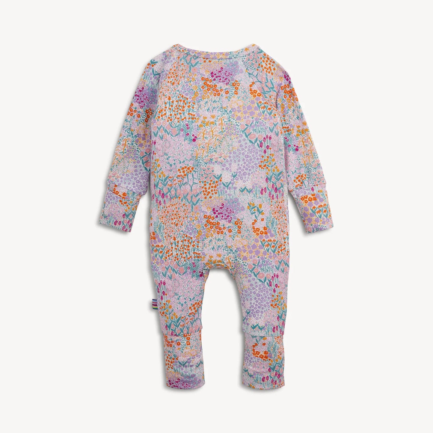 A baby long-sleeve one-piece romper with an all-over colorful floral and butterfly pattern on a light pink base.