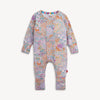 A baby long-sleeve one-piece romper with an all-over colorful floral and butterfly pattern on a light pink base.