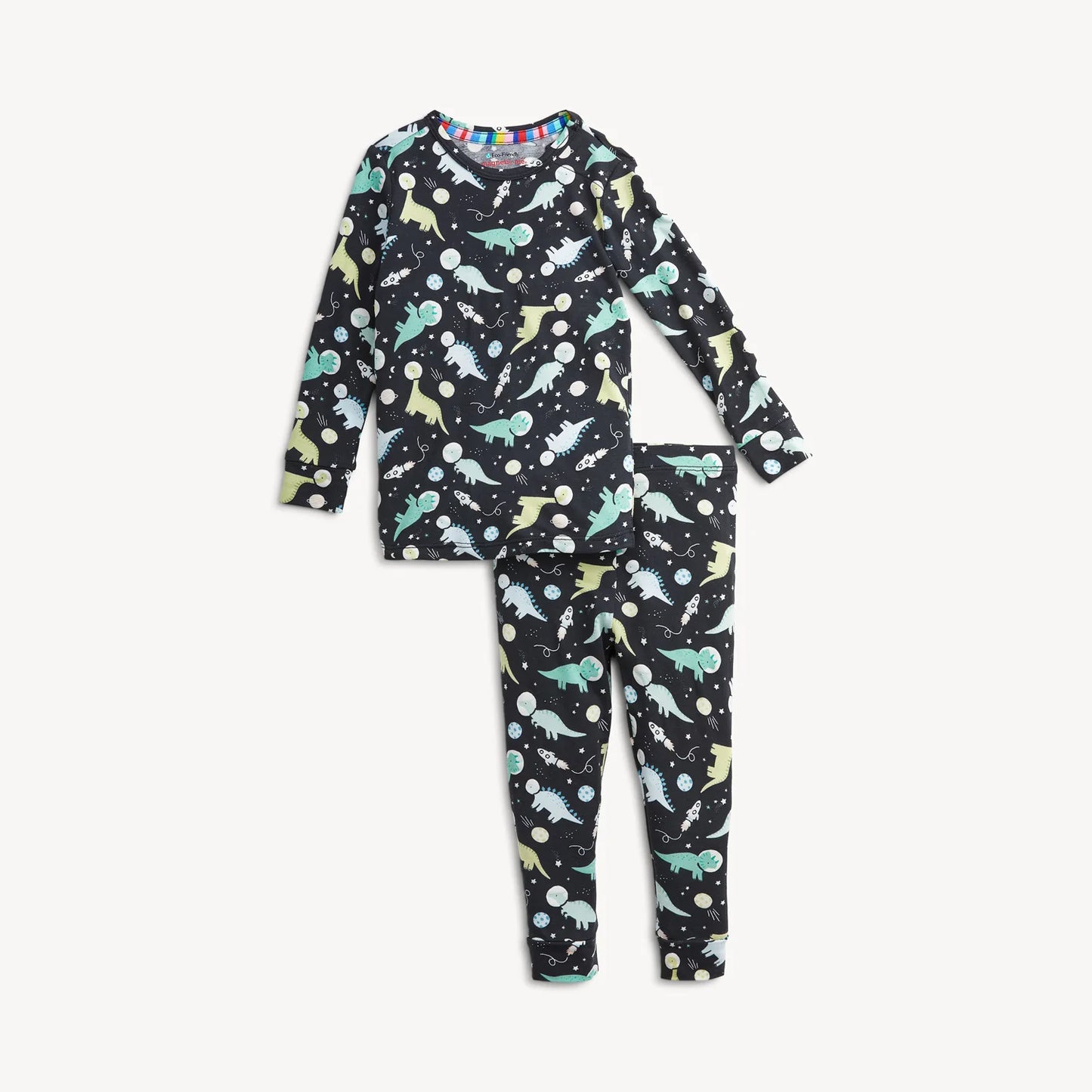 A two-piece children's pajama set featuring a long-sleeve top and matching pants in a dinosaur print with colorful dinosaurs, planets, and stars.