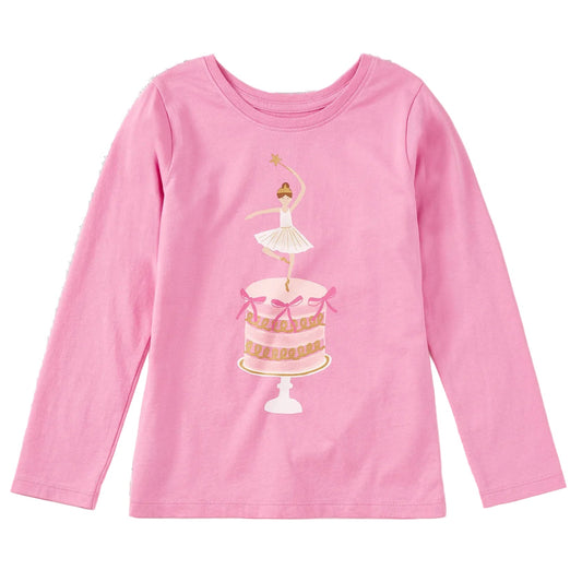A pink long-sleeve crewneck shirt for kids, featuring a graphic print of a ballerina dancing on top of a decorated cake on a white background.