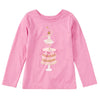 A pink long-sleeve crewneck shirt for kids, featuring a graphic print of a ballerina dancing on top of a decorated cake on a white background.