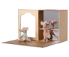 Toy mouse figures in a display case with a white background