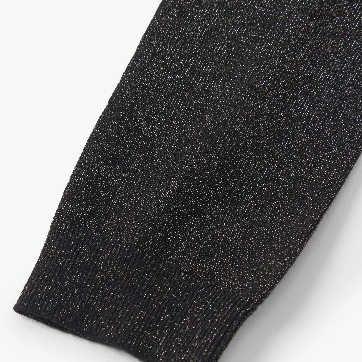 Close-up of a black glittery fabric on a white background