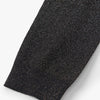 Close-up of a black glittery fabric on a white background