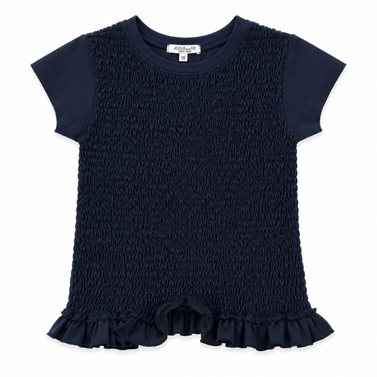black smocked romper with ruffle details on a white background