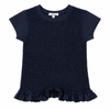 black smocked romper with ruffle details on a white background