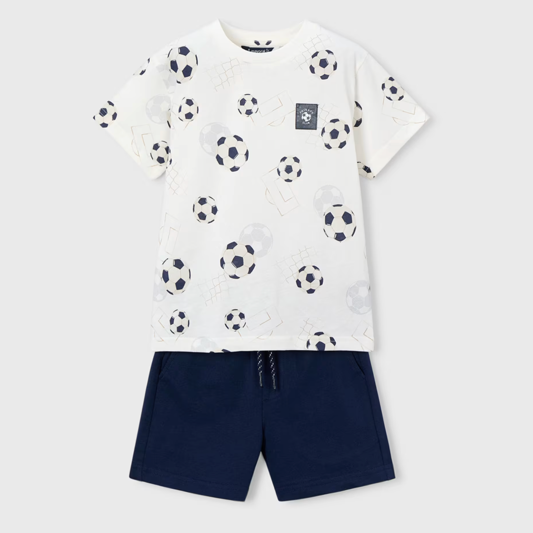 White t-shirt with soccer ball pattern and navy shorts set