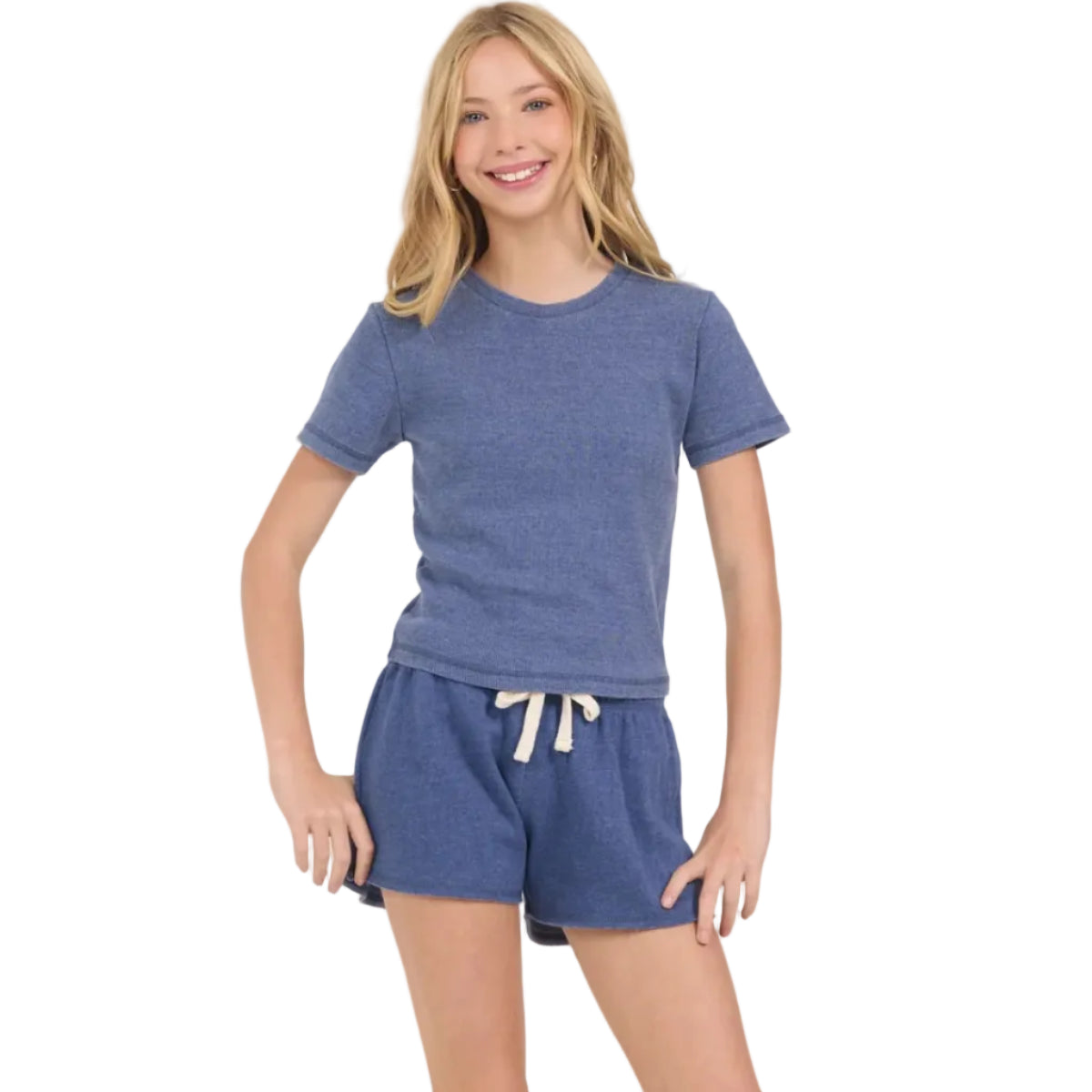 Girl wearing a blue t-shirt that hits at the waist