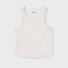 White tank top with decorative embellishments around neckline