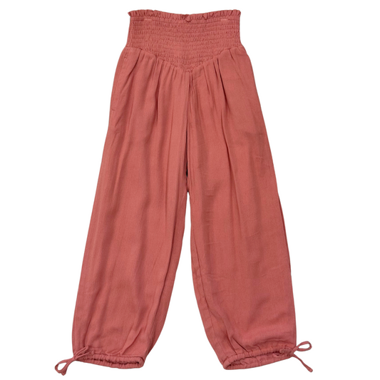 Pink pants with drawstring waist on a white background