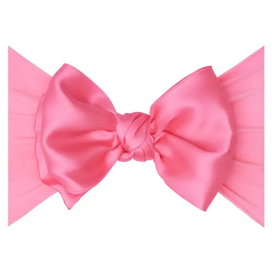 Pink satin bow on headband