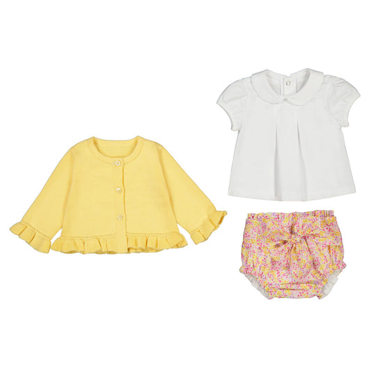 Yellow cardigan, white blouse, and floral bloomers on a white background