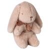 Plush bunny toy with a gold bow on a white background
