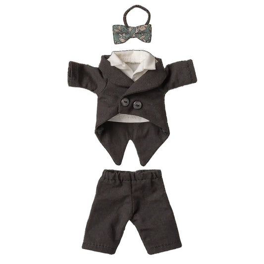 Doll outfit with jacket, pants, and bow tie on a white background