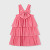 Coral pink tiered dress with halter straps and bow at the chest.  