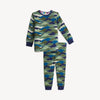 A two-piece children's pajama set featuring a long-sleeve top and matching pants with a geometric mountain camouflage pattern in shades of green, blue, and navy, finished with solid navy ribbed cuffs and collar.