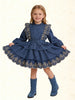 A young girl modeling a blue denim tiered dress with gold floral embroidery and matching blue denim boots.