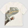 White t-shirt with a chameleon graphic on a light gray background