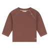A toddler's long-sleeve ribbed knit top in a dusty brown color, featuring a buttoned shoulder and a small brand patch near the hem, shown on a plain white background.