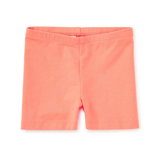 Coral shorts on a white background