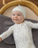 Cloud Floral Bamboo Zip Footie, lifestyle photo of baby
