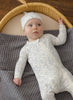 Cloud Floral Bamboo Zip Footie styled on baby