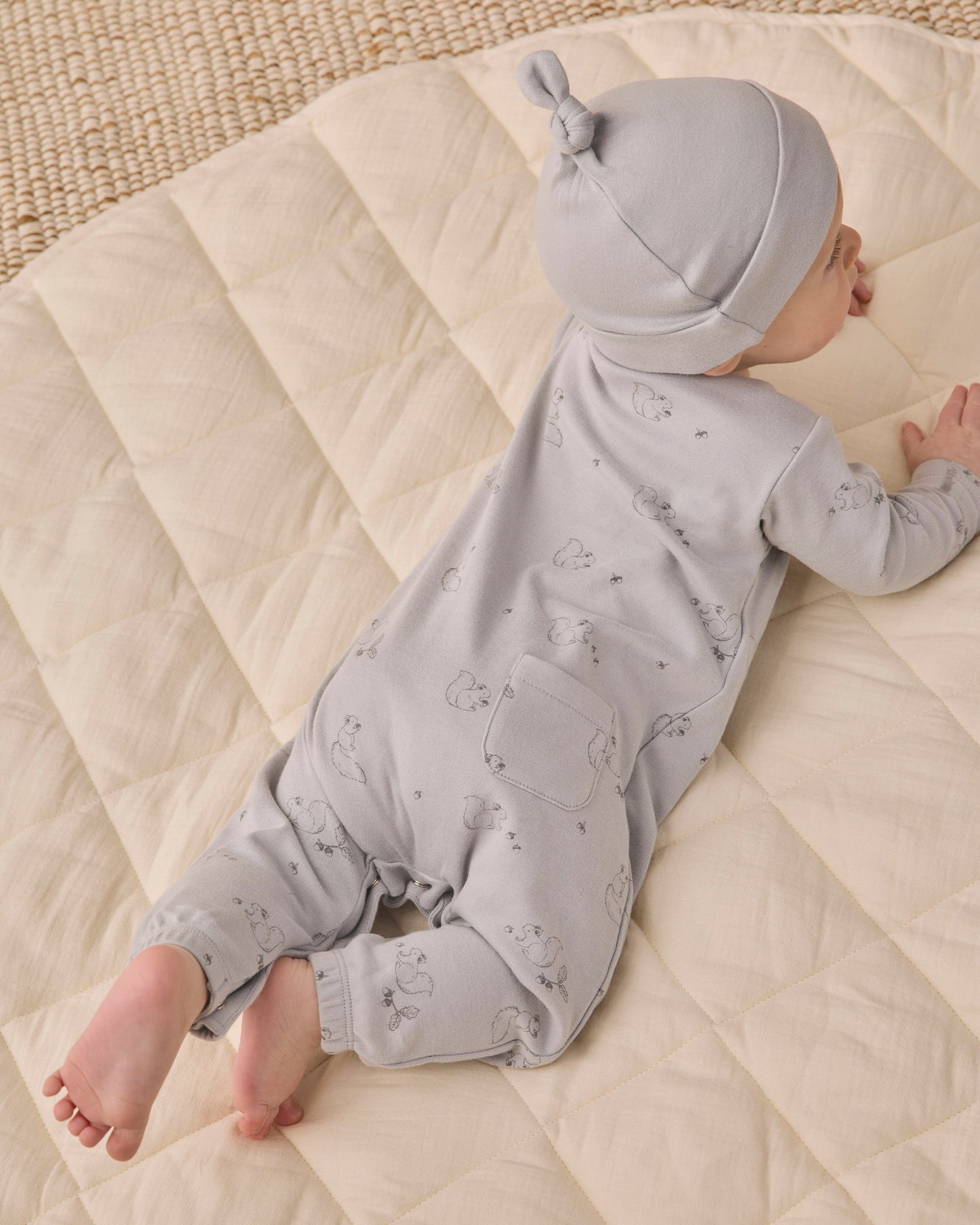 Baby wearing the Cloud Knotted Hat by Quincy Mae