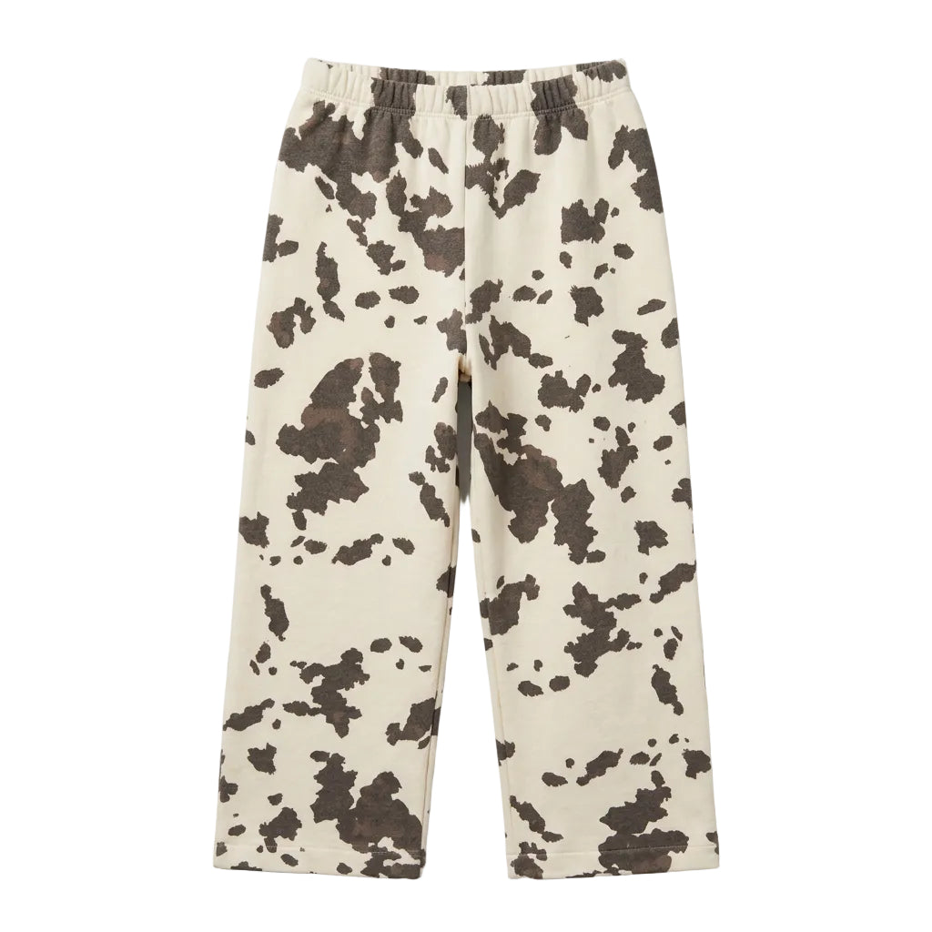 A pair of cropped sweatpants with a cow-print pattern in beige and dark gray, sweatpants 